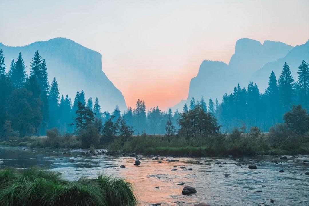 I was freezing cold staying in the tent cabins in Half Dome (formerly Curry) Village in Yosemite Valley with my dad who was there for work, so I got up and drove around the valley at 6 am. There’s been lots of fires in the area and the valley was filled with this thick smoke. Stopped at a turnout near Tunnel View and shot this photo - I really love the symmetry of it and the smooth gradients the smoke produces.